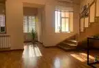 brown wooden parquet floor near white wooden door