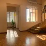 brown wooden parquet floor near white wooden door