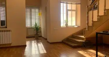 brown wooden parquet floor near white wooden door