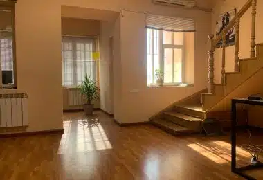 brown wooden parquet floor near white wooden door